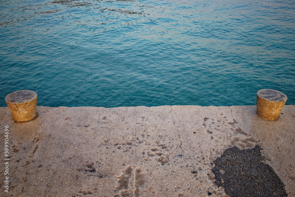 high angle view of an concrete pier with turquoise water