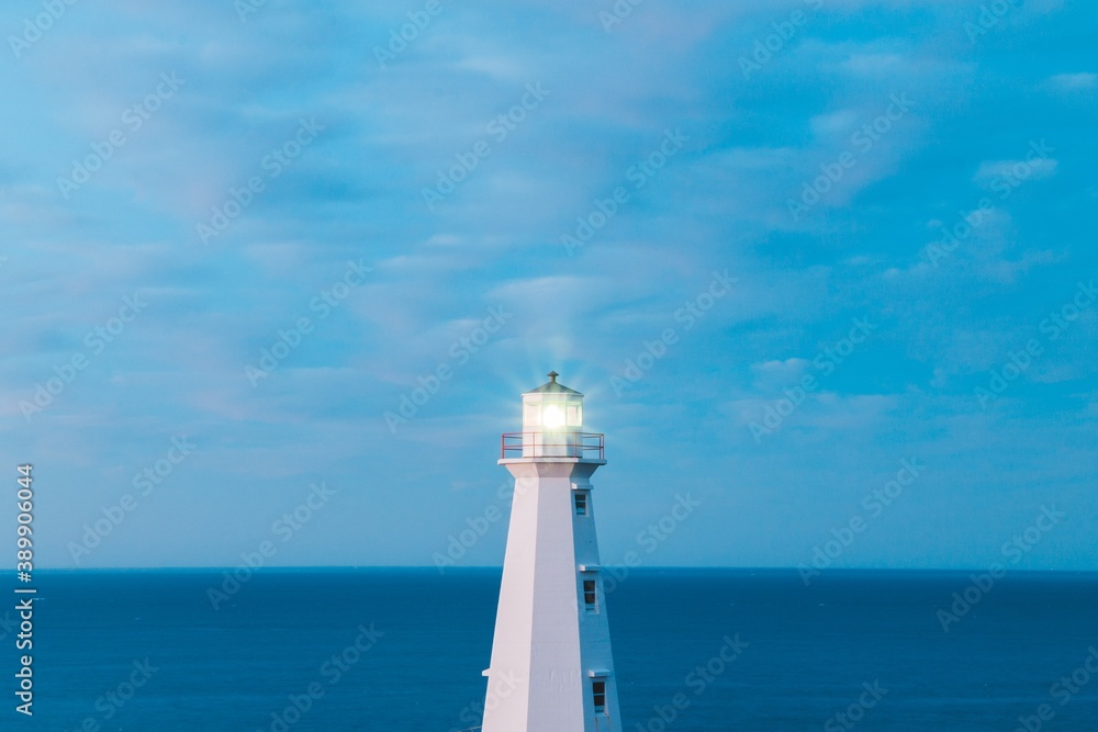 lighthouse on the coast of newfoundland during blue hour