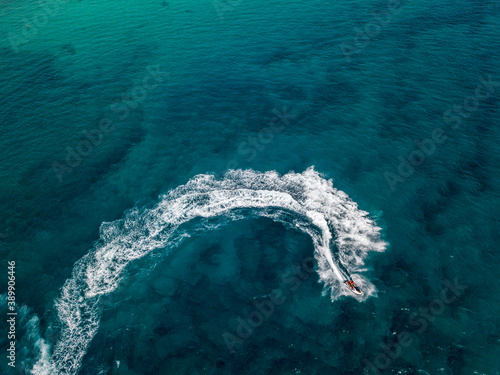Aerial view of a jet ski cruising at full speed. Fun and holidays, water sport. Sea and waves
