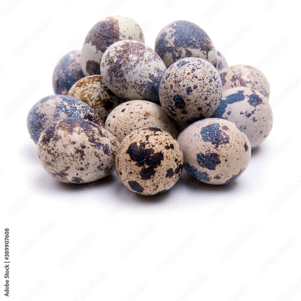 Quail eggs, close-up on a white background, copy space, Quail eggs, close-up on a white background, copy space,