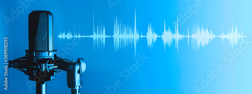 Microphone with waveform on blue background, broadcasting or podcasting banner photo