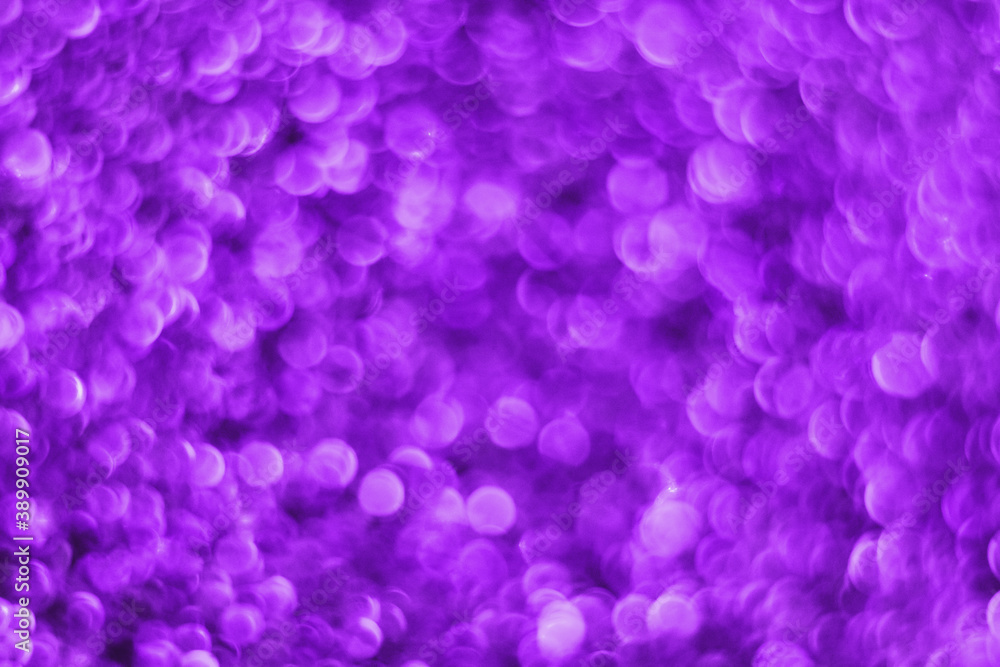 Glitter splash and lens flare on purple shiny trendy background. Sequins. Festive background for your projects. Blurred purple festive bokeh lights. Christmas festive time concept on background. Glitter splash and lens flare on purple shiny trendy background. Sequins. Festive background for your projects. Blurred purple festive bokeh lights. Christmas festive time concept on background.