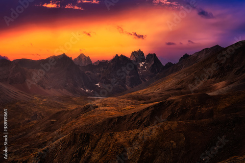 Aerial View of Scenic Landscape and Mountains on a Cloudy Fall Season in Canadian Nature. Colorful Twilight Sky Artistic Render. Taken in Tombstone Territorial Park, Yukon, Canada.