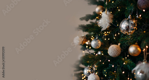 grey background with christmas tree and gold ornaments