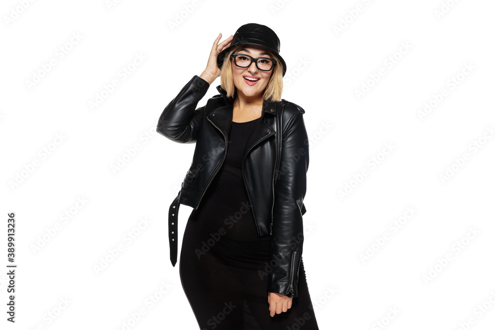 Pretty. Beautiful young blonde woman in total black attire, outfit and eyewear isolated on white studio background. Magazine style, fashion, beauty concept. Fashionable posing. Copyspace for ad. Pretty. Beautiful young blonde woman in total black attire, outfit and eyewear isolated on white studio background. Magazine style, fashion, beauty concept. Fashionable posing. Copyspace for ad.