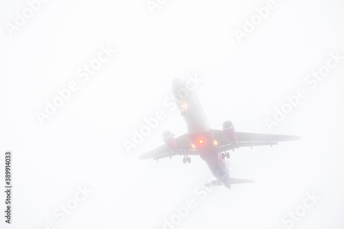 view of landing plane in misty weather