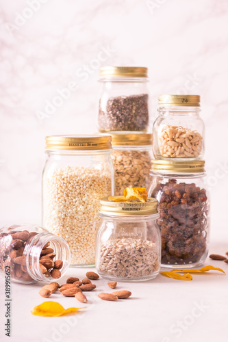 Zero waste pantry. Breakfast products preserved in reusable glass jars: cereals, dried fruit and various seeds. Jars can be refilled several times with bulk products. Plastic free.