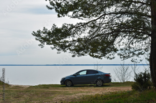 car on the river bank