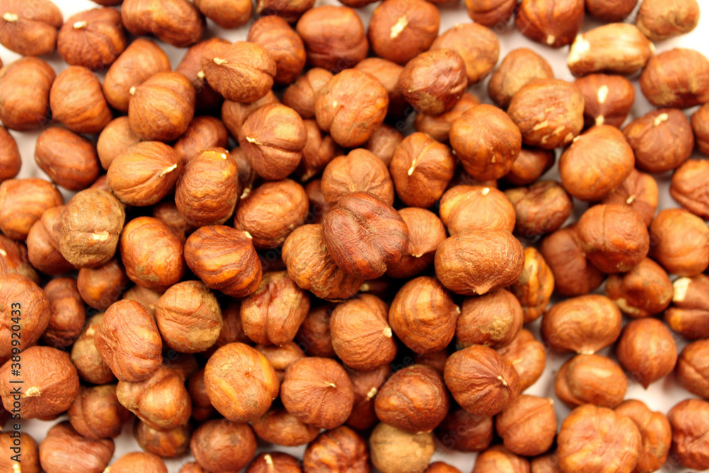 Brown dried peeled hazelnuts. Nut background Brown dried peeled hazelnuts. Nut background