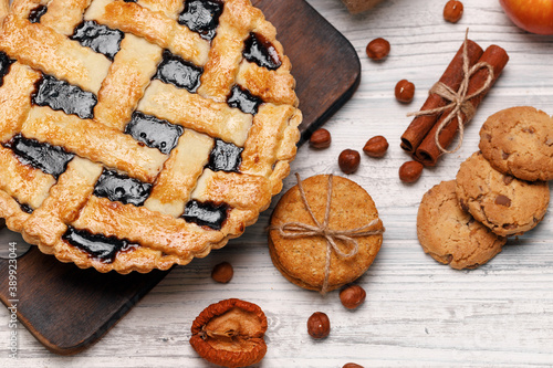 Berry tart pie on white wooden table