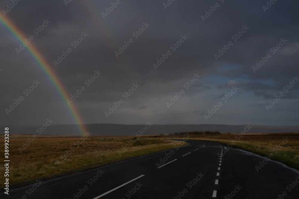 rainbow over a moorland road in Northumberland