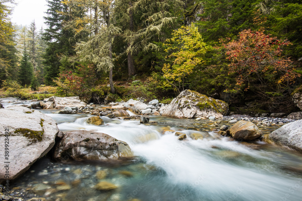 Flowing autumn waterfall in Chamonix in the French Alps Flowing autumn waterfall in Chamonix in the French Alps