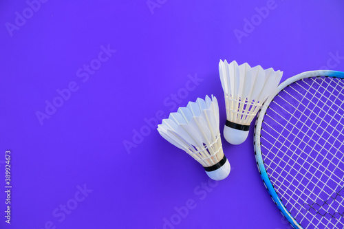 Badminton shuttlecocks feather and badminton racket  concept for badminton lovers around the world.