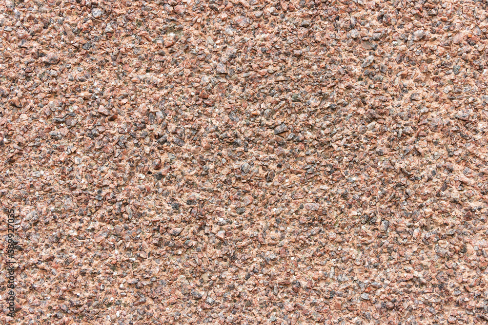The surface of a rough uneven wall, plastered with fine marble chips. The surface of a rough uneven wall, plastered with fine marble chips.