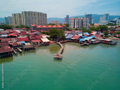 The clan jetties (the house on the water) and the pier in George town on Penang island, Malaysia. Photographed from a drone. © Anna