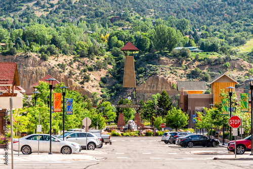 Glenwood Springs, USA - June 29, 2019: Shopping meadows mall park buildings in Colorado town near red mountain and cars parked photo