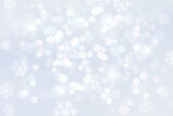 Light bokeh background with snowflakes