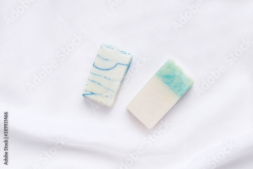 Handmade soap on white linen fabric
