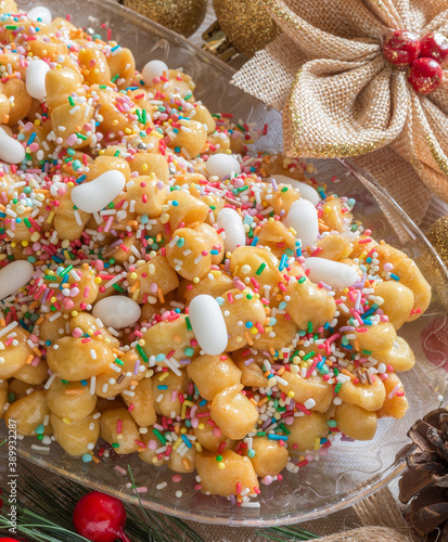 Neapolitan pastry called struffoli - Little shortcrust pastry balls fried dipped in honey photo