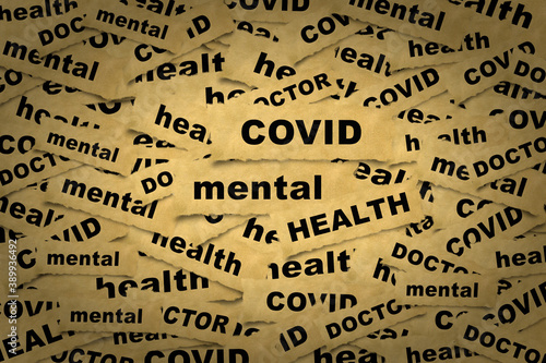 Abstract background from pieces of paper with the inscription covid mental health and related words