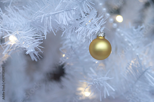 Gold Ornament White Christmas Tree Closeup