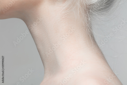 Neck. Close up portrait of beautiful albino female model. Parts of face and body. Beauty, fashion, skincare, cosmetics, wellness concept. Copyspace. Well-kept skin, fresh look, details.