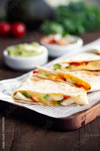 Typical Mexican quesadillas with chicken, pepper and cheese.