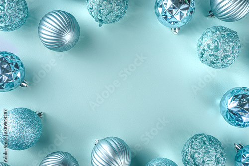 Christmas Festive Banner, Background. Monochrome Flat-lay with various blue Christmas Decoration Balls over light blue background, top view copy space, simple pattern