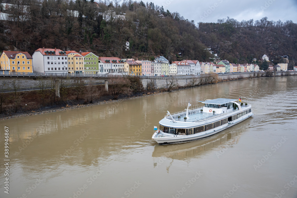 Obraz premium a pleasure boat sails along the Danube to Passau