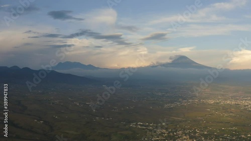 4k Aerial drone footage of Popocatepetl and Iztaccihuatl's volcanoes from Oaxtepec, Morelos, Mexico at sunset photo