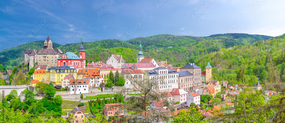 Aerial panoramic view of medieval Loket town with Loket Castle Hrad Loket gothic style on massive rock, colorful buildings. Panorama of Loket town and green hills, Karlovy Vary Region, Czech Republic