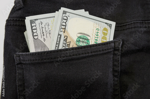dollars in jeans pocket. Close-up.