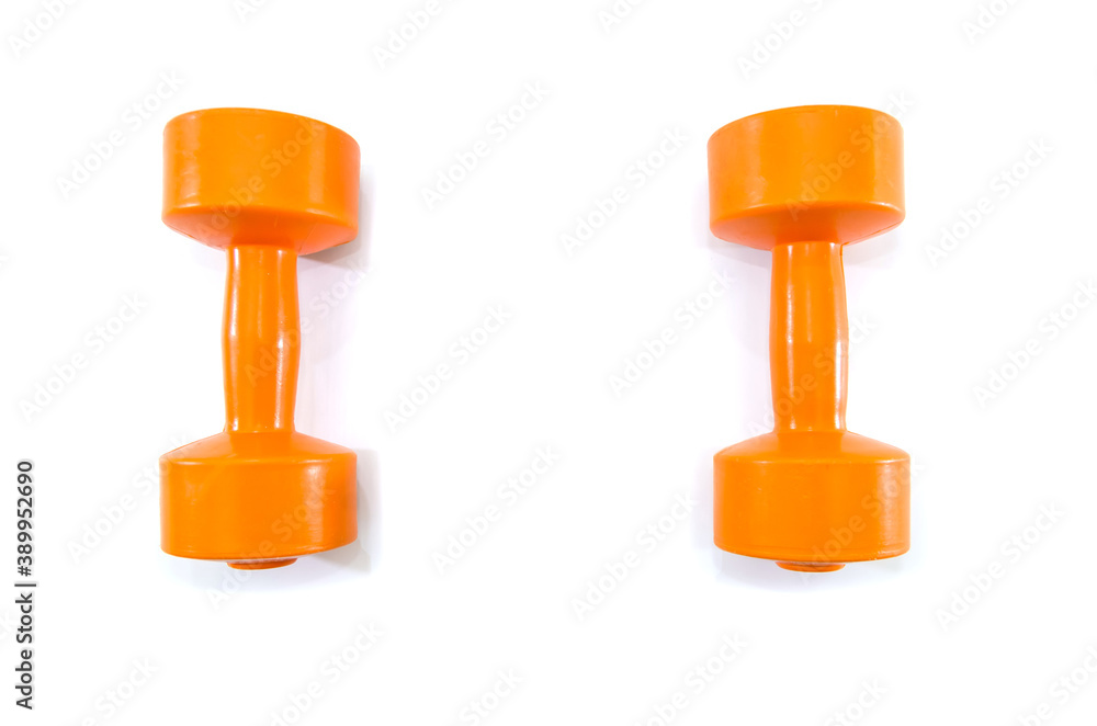 two orange dumbbells on a white background. two orange dumbbells on a white background.