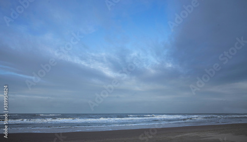 Fototapeta Naklejka Na Ścianę i Meble -  Sea, waves and beach. North sea coast. Julianadorp. Netherlands.