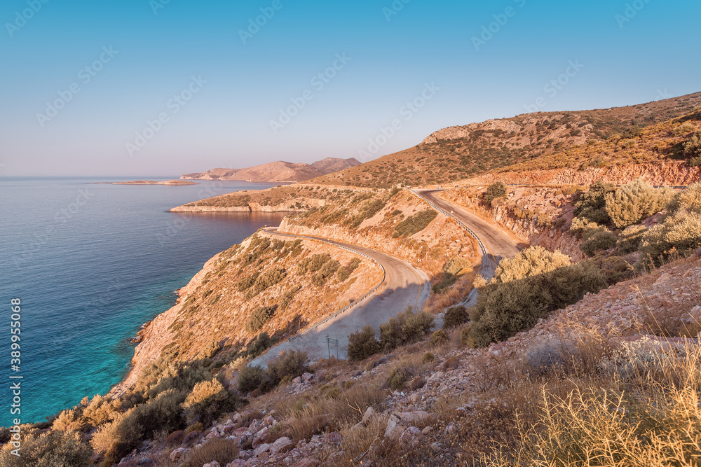 The highway road winds serpentine on the coast of the Mediterranean sea. Dangerous and beautiful road adventure