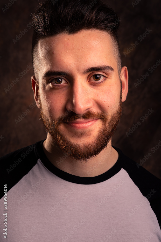 Naklejka premium Handsome man posing at a studio