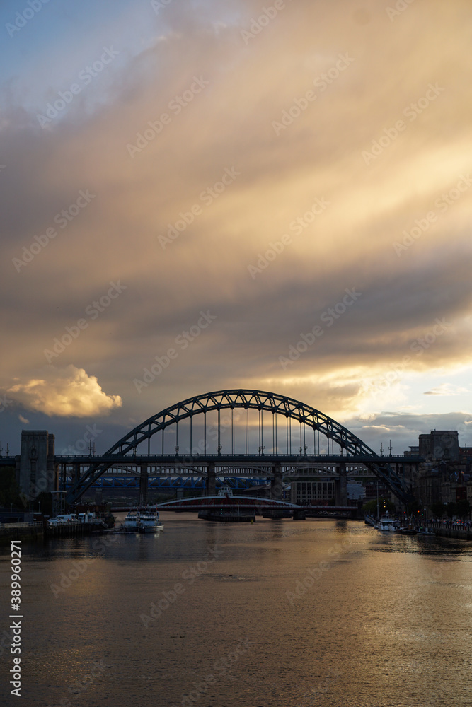 Stunning sunset over the Tyne bridge in Newcastle upon Tyne with dramatic clouds overhead