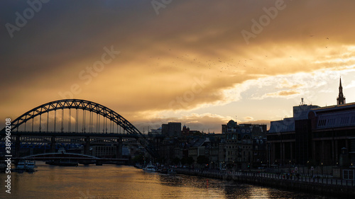 Golden rays bursting through clouds at sunset over Newcastle upon Tyne