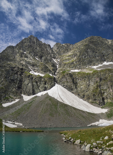 View of the Imereti lake and mountains. Blue lake surrounded by mountains and glaciers. photo