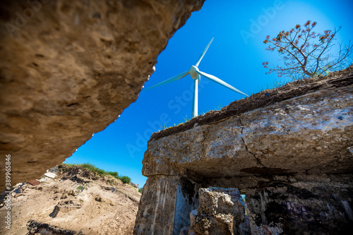Old war fort ruins on the beach with a wind turbine. Liepaja, Latvia