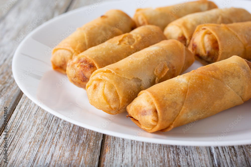 A closeup view of a plate of egg rolls. A closeup view of a plate of egg rolls.