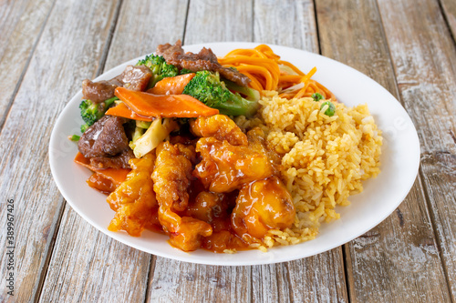 Принти на полотні A view of a Chinese fast food 2 item combo plate, featuring orange chicken and beef broccoli