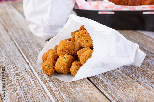 A view of a bag of deep fried okra.