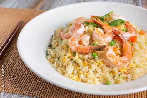 A view of a plate of shrimp fried rice.