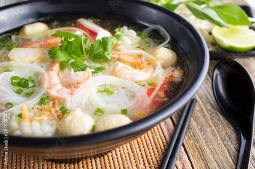 A view of a bowl of seafood pho.