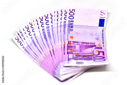 Stack of 500 Euro banknotes. European currency money banknotes isolated on white backdrop. Top view closeup. Salary, savings, european union economic crisis concept
