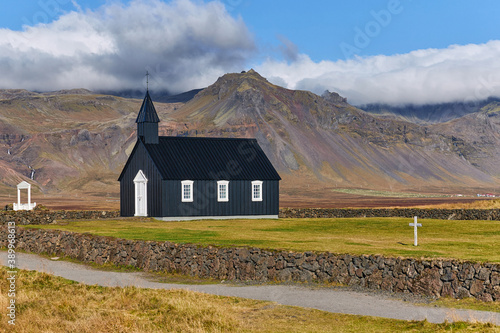 death, black church standing alone in icelandic landscape, icelandic autumn in beautiful weather, famous places without tourists, covid affects tourism