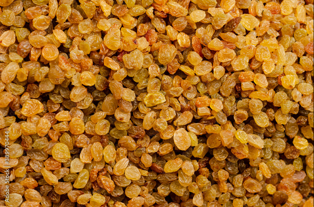 Closeup of appetizing yellow raisins Closeup of appetizing yellow raisins