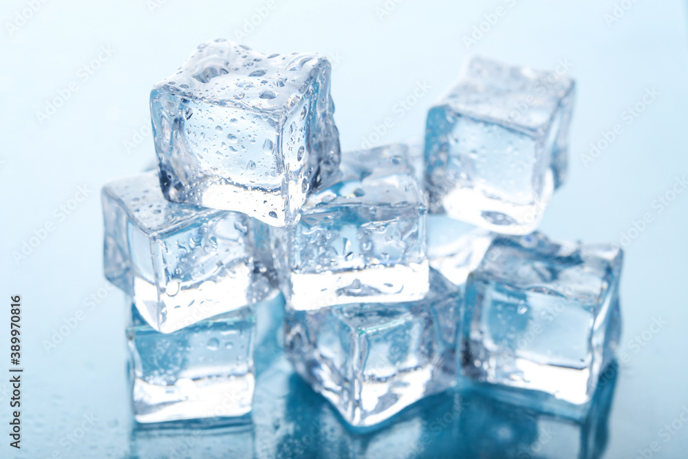 Ice cubes with water drops on blue background Ice cubes with water drops on blue background