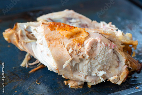 Leftover food. hicken carcass. Cutlery, knife. photo